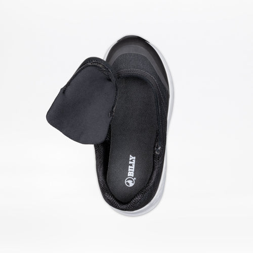 The Black BILLY Goat by BILLY Footwear is an AFO-friendly kids’ shoe with a wide, adjustable flap that reveals the branded inner sole. Shown top-down on a white background, it provides comfort and accessibility.