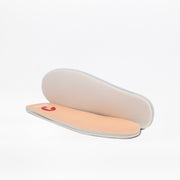 Two rose gold Glitz BILLY CS High insoles from BILLY Footwear are displayed on a white background—one lies flat showing the red logo on top, while the other stands upright to reveal its underside.