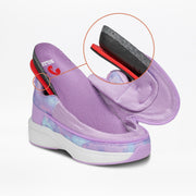 The BILLY Footwear Lilac Watercolor BILLY Limitless is a lavender platform sandal with mesh fabric and a white sole, shown in close-up to reveal black, red, and purple cushioning—an adaptive shoe designed for comfort.