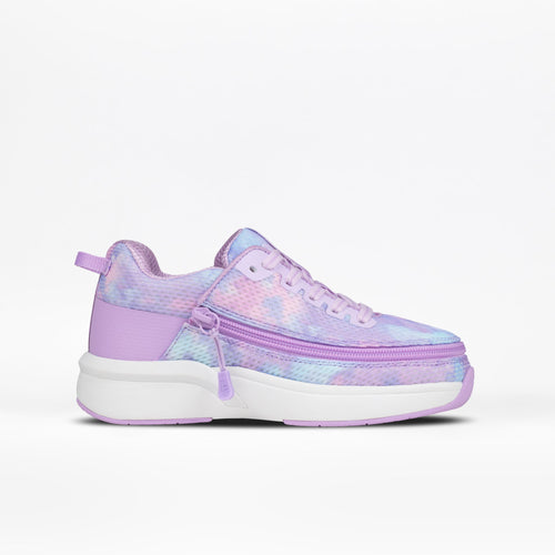 The Kids' Limitless by BILLY Footwear is a lilac, pastel-inspired adaptive sneaker for kids, featuring laces, a front zipper for easy access, and a thick white sole with colorful pink-purple-blue tie-dye accents.