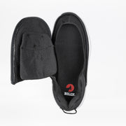The Women's Black BILLY Limitless by BILLY Footwear features a side and top zipper for easy-on/easy-off access, adjustable depth, and reveals the red BILLY logo on the insole.