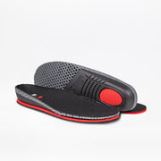 A pair of black and gray insoles with red accents for the Women's White Leather BILLY Comfort Luxe by BILLY Footwear—one laid flat to display its textured top, the other upright revealing the patterned underside and cushioned heel.