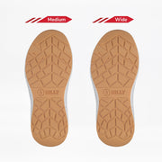 Two tan rubber soles for the BILLY Footwear Women's Black/White/Gum BILLY Sport Inclusion DZ1 are shown side by side, labeled Medium and Wide. Both feature similar tread patterns and "BILLY" near the heel.