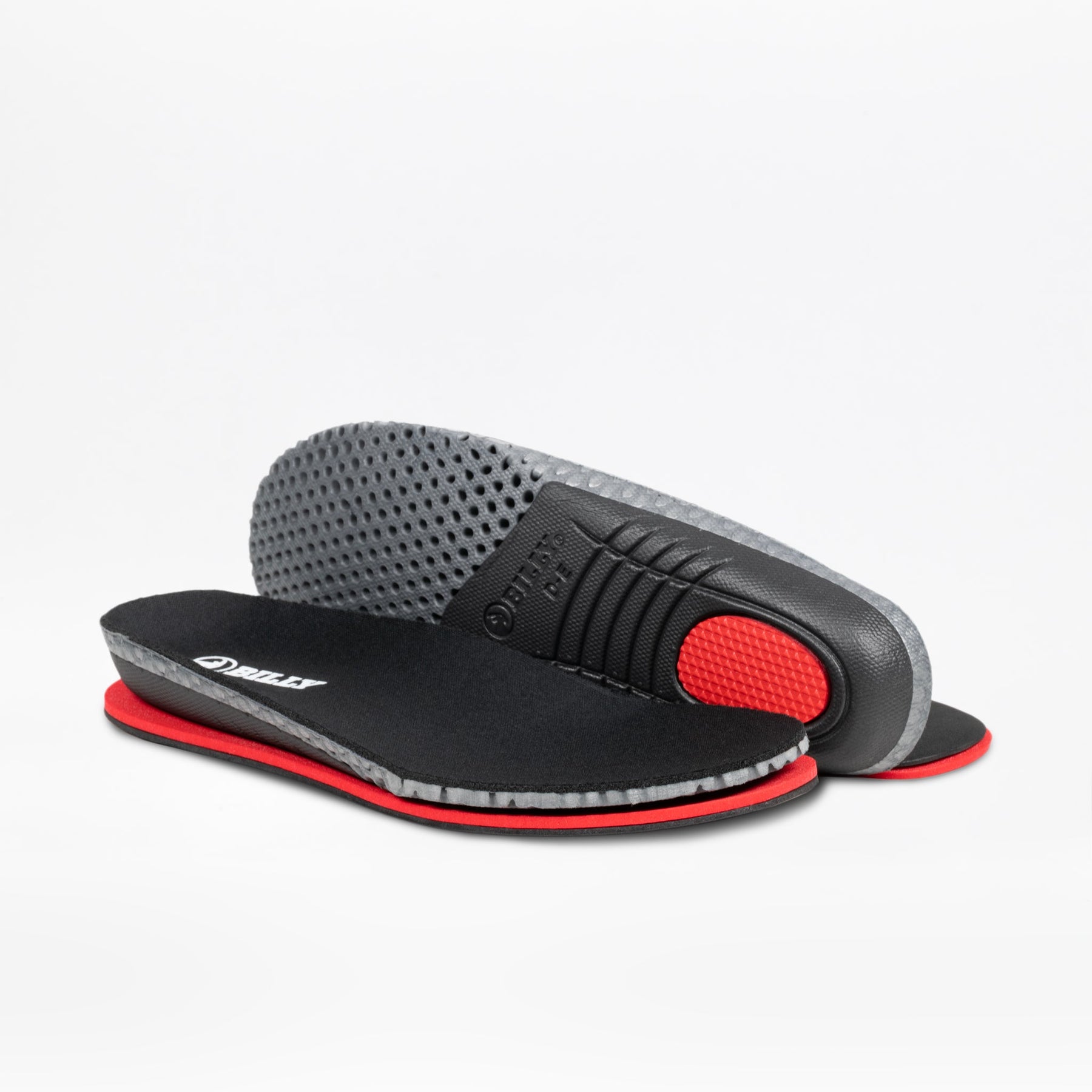 A pair of BILLY Sport Inclusion DZ1 insoles by BILLY Footwear, shown in black/white/gum with gray textured undersides—one flat, one propped up—highlighting their cushioning and grip, perfect for boosting comfort in sneakers.